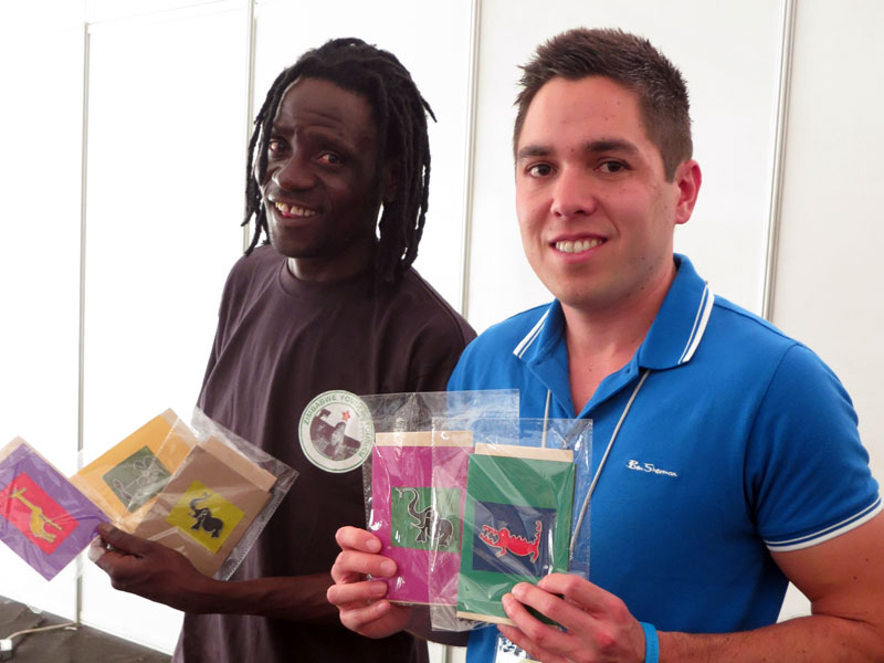 Elias and Kieron holding up hand-made cards from Zimbabwe